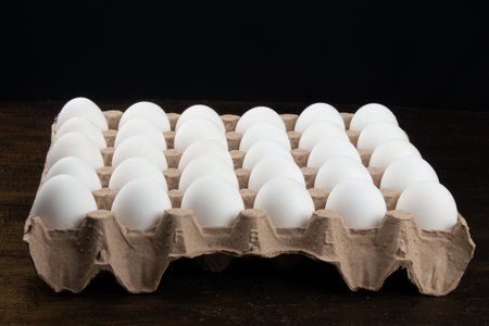 Cartouche with white chicken eggs.