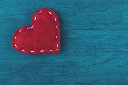 Red hearts on blue backgroundの写真素材