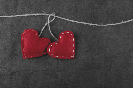 Valentine's day background with red heart and gray backgroundの写真素材