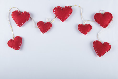 Valentine's day background with red hearts and white backgroundの写真素材