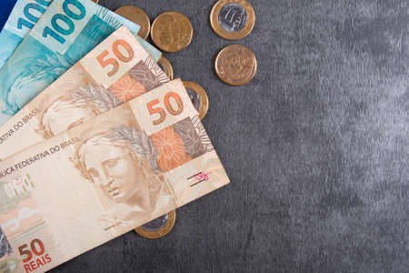 Brazilian money banknotes and coins finance concept.の写真素材