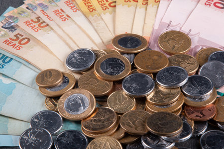 Brazilian money banknotes and coins finance concept.