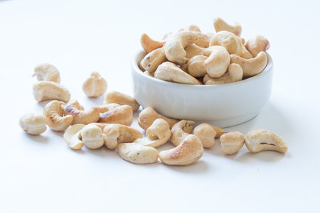 roasted cashew nuts on and white background.の写真素材