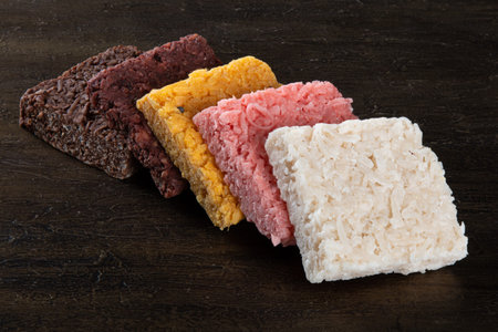 Coconut candy, sweet Brazilian in background with rustic wood.