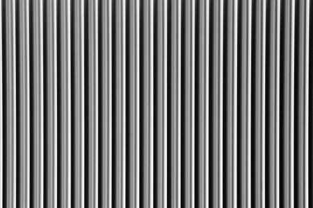 Abstract silver background with vertical lines, lit with a soft light