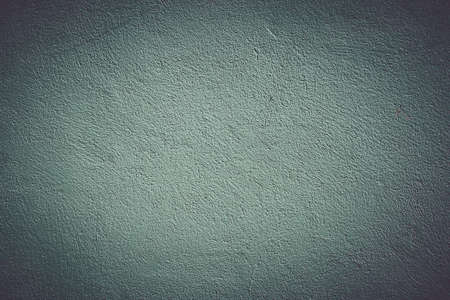 Background with wall texture with dark green paintの写真素材