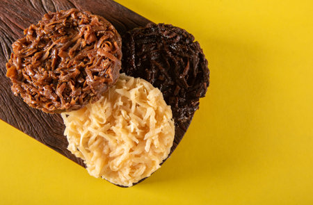 Coconut Candy on Yellow Background top view.