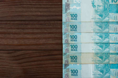 Brazilian money. 100 reais banknotes. Copy space.の写真素材