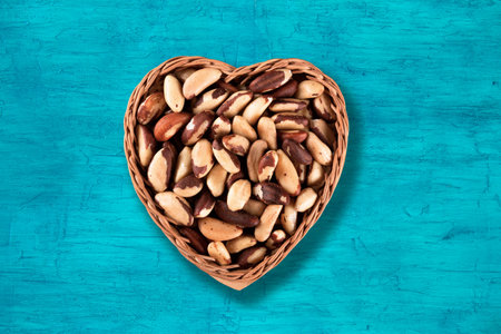 Brazil nuts in a heart basket top view.