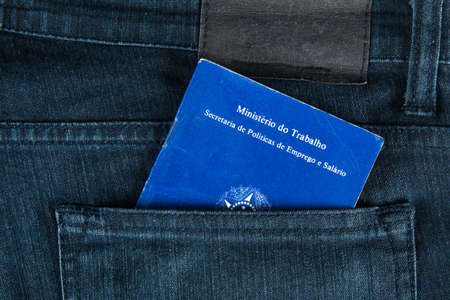 Brazilian document work and social security (Carteira de Trabalho e Previdencia Social) in a jeans pocket.の写真素材