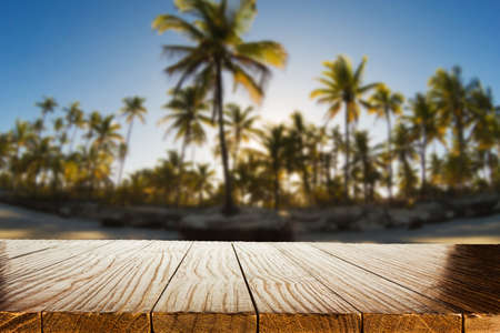 Empty wood table with blurred background with tropical nature landscape. Product display templateの写真素材