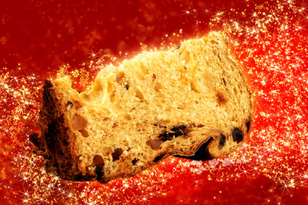 panettone with sliced traditional christmas food piece with red background.の写真素材