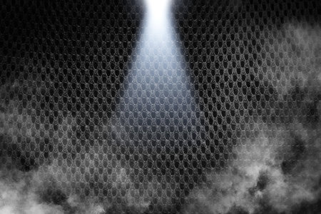 Black fabric texture background closeup with smoke and light spot.の写真素材