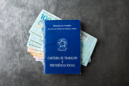 Brazilian work card on brazil money banknotes.