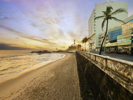 Sunset at Barra beach in Salvador Bahia with Barra Lighthouse in the background.の写真素材