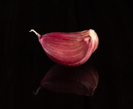Closeup Garlic clove with black background.の写真素材