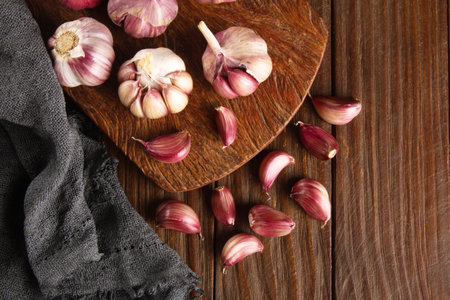 Closeup Garlic clove and bulb on wooden background top view.の写真素材
