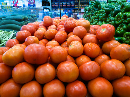 red tomatoes for sale in the market.の写真素材