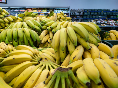 Ripe yellow bananas for sale at the market.の写真素材
