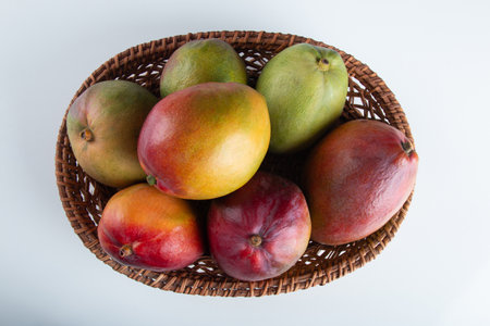 Mango fruits in basket with white background.の写真素材