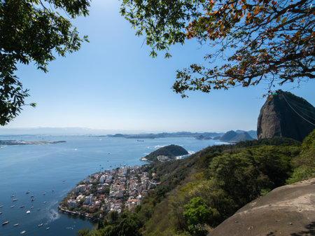 Panoramic view of Rio de Janeiro from Urca Hill showcasing bay mountains and urban landscape.の写真素材