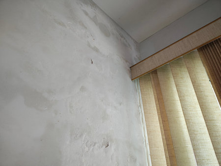 Mold and damp stains on wall corner.の写真素材
