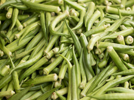 Green okra pods piled together.