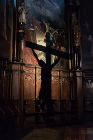 Projection of the shadow of the crucifix on the wall of a churchのeditorial素材