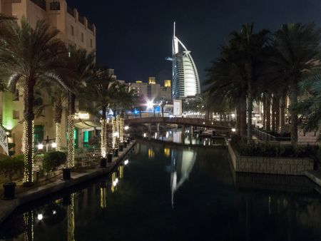 Dubai, UAE - March, 03, 2017: View of the luxury Burj Al Arab, the most exclusive hotel of the world, with seven stars from Souk Madinat Jumeirah at night.のeditorial素材