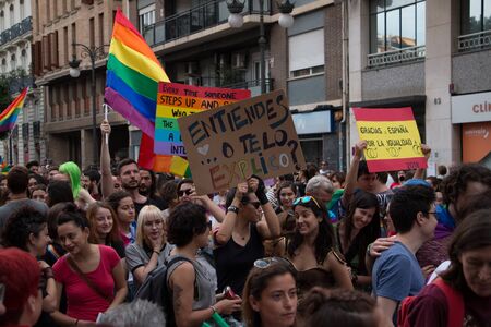 Valencia, Spain - June 16, 2018: People holding banners in the gay pride paradeのeditorial素材