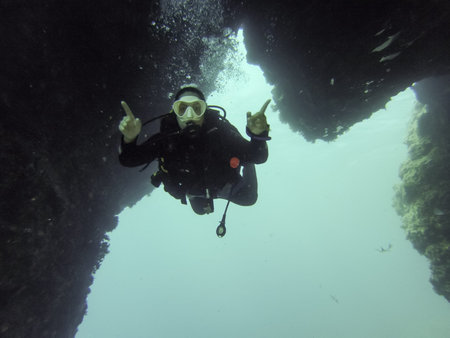 Young female scuba diver in Atlantic ocean.
