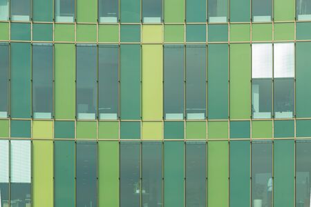 Cool green glass panels of a modern architecture. Architectural abstract.の写真素材