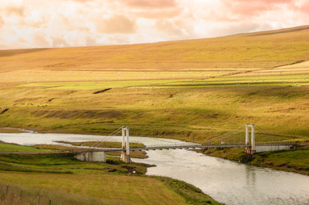 Suspension bridge over the river Blönda (Blanda) in Sv?nvetningabraut, in northern Iceland on route...