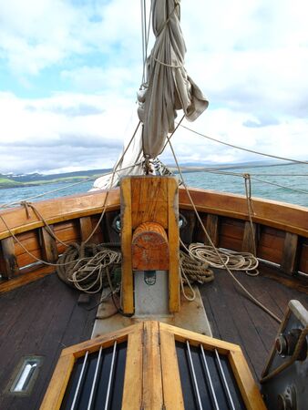 View of the bow of an old sailing ship sailing in the Arctic sea. Sailing conceptの写真素材