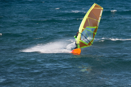 A windsurfer is racing with the wind in Canary islands, Spain. Sport conceptの写真素材