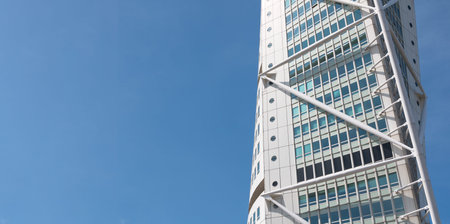 Partial panoramic view of the Turning Torso building in Malmo, Sweden with blue sky in the background. Architecture conceptのeditorial素材