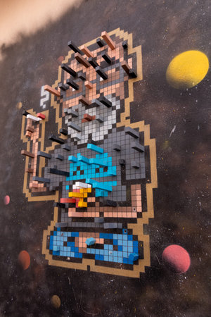 Fanzara (CastellÃ³n), Spain - September 20, 2020: Urban art work of a 3D pixelated man, in the...