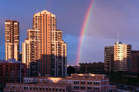 Valencia city skyline with a rainbow in the sky. Weather conceptの写真素材