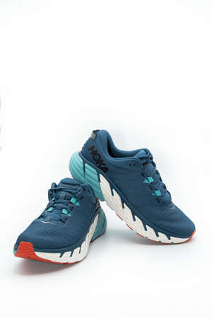 Valencia, Spain -November 7, 2021: Studio shoot of Hoka One One Gaviota 3 running shoes isolated over white backgroundのeditorial素材