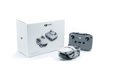 Valencia, Spain - December 13, 2021: Unpacking smallest drone launched by the DJI company. Folded...