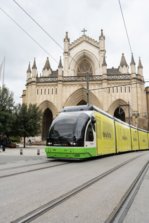 Vitoria-Gasteiz, Spain - 14 April, 2022: Euskotren electric with the Cathedral of Santa Maria in background, Vitoria in the Basque Countryのeditorial素材