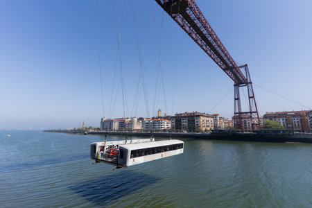 Portugalete, Spain - April 16, 2022: The Bizkaia suspension transporter bridge (Puente de Vizcaya) in Portugalete, Spain. The Bridge crossing the Nervion Riverのeditorial素材