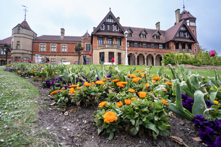 San Sebastian, Spain - April 17, 2022: Municipal Palace of Miramar next to La Concha beach in San Sebastian with the flowers in its garden in the foregroundのeditorial素材