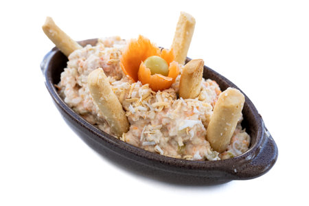 Studio photo on white background of a typical Spanish tapa called "ensaladilla rusa" (Russian salad). Spanish cuisine conceptの写真素材