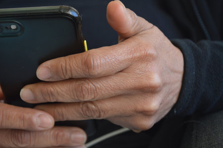 a pair of hands holding a smartphone