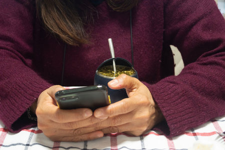 a lady looking at her cell phone