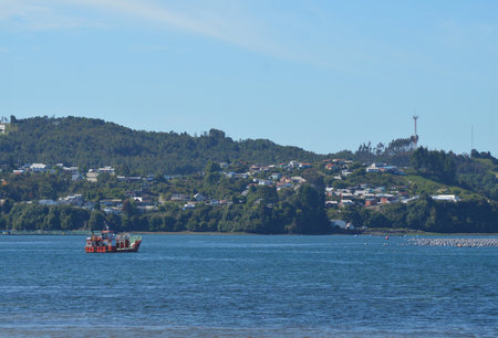 a fishing village and a boat in Chiloe in southern Chileの写真素材