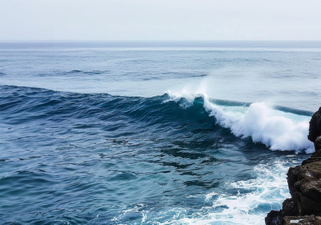 some waves seen from a cliffの写真素材