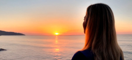 a woman watching a sunset on a torpical beach generated with artificial intelligence
