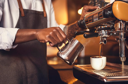 a barista serving a special coffeeの写真素材